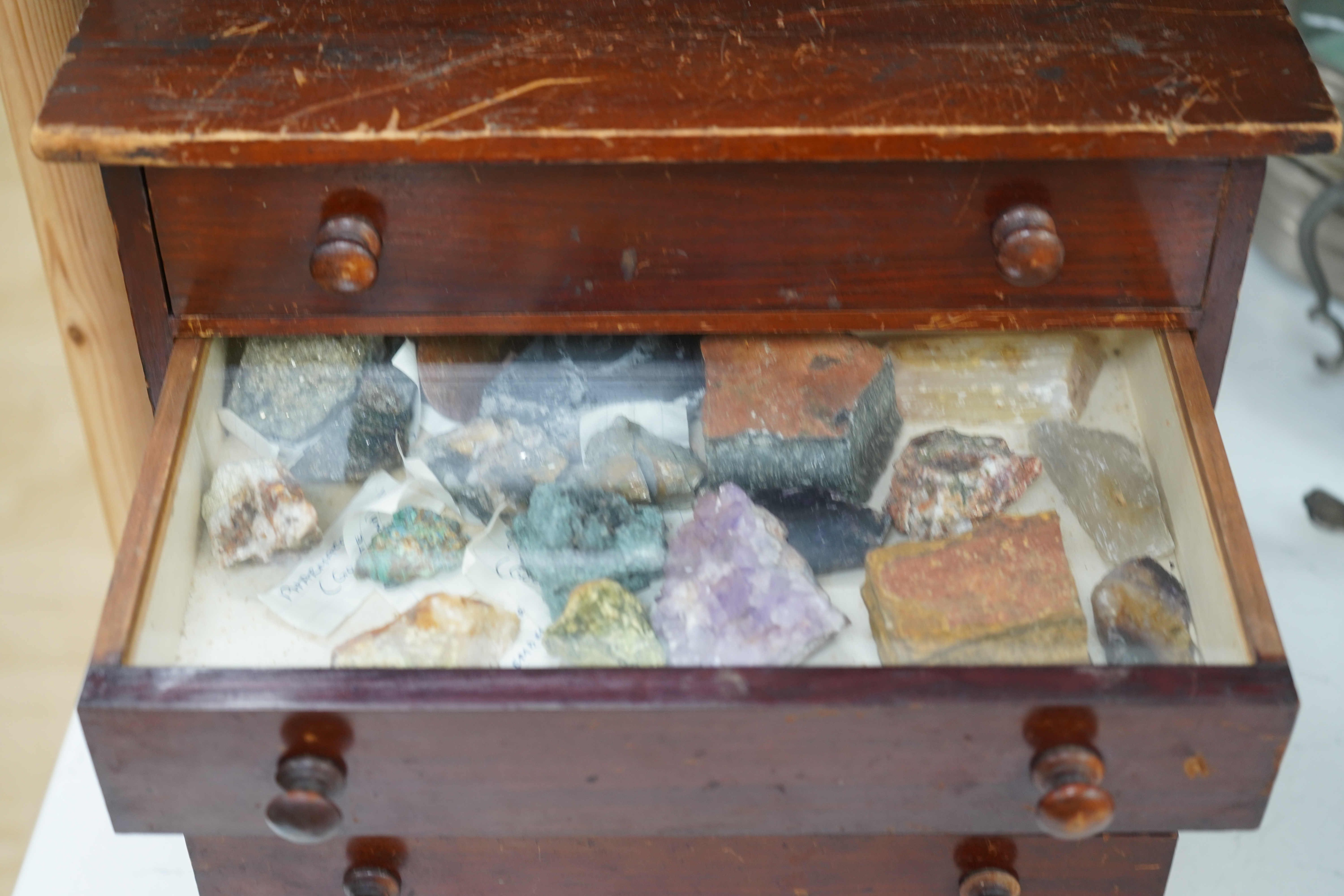 An early 20th century collector’s chest fitted with five drawers filled with mineral specimens and butterflies to include Haematite, Scorodite and Pyrite, 30cm high. Condition - fair